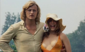 Movie still from “Turkish Delight” (1973), directed by Paul Verhoeven – A man and a woman standing next to each other; Medium shot, Low angle