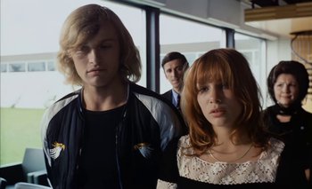 Movie still from “Turkish Delight” (1973), directed by Paul Verhoeven – A group of people standing next to each other in a room; Medium shot, Low angle