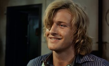 Movie still from “Turkish Delight” (1973), directed by Paul Verhoeven – A person with long blonde hair; Close Up shot, Over the shoulder angle