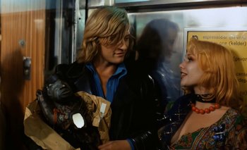 Movie still from “Turkish Delight” (1973), directed by Paul Verhoeven – Two people on a bus talking to each other; Medium shot, Over the shoulder angle