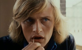 Movie still from “Turkish Delight” (1973), directed by Paul Verhoeven – A person with long blonde hair; Close Up shot, Low angle