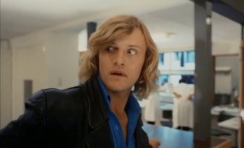 Movie still from “Turkish Delight” (1973), directed by Paul Verhoeven – A man with long blonde hair wearing a blue shirt; Close Up shot, Low angle