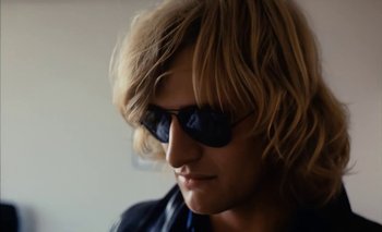 Movie still from “Turkish Delight” (1973), directed by Paul Verhoeven – A person wearing sunglasses; Close Up shot, Low angle