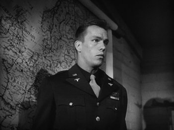 Movie still from “Twelve O'Clock High” (1949), directed by Henry King – Black and white photograph of a man in military uniform; Close Up shot, Low angle