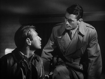 Movie still from “Twelve O'Clock High” (1949), directed by Henry King – Two men are talking to each other in a black and white photo; Medium shot, Over the shoulder angle