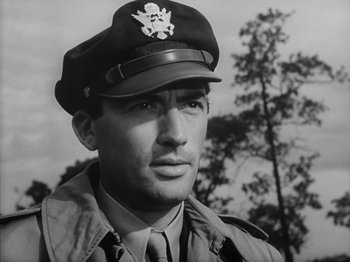 Movie still from “Twelve O'Clock High” (1949), directed by Henry King – A man in a military uniform wearing a hat and a tie; Close Up shot, Low angle