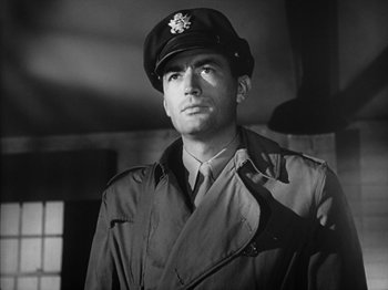 Movie still from “Twelve O'Clock High” (1949), directed by Henry King – A man wearing a hat and a uniform; Close Up shot, Low angle