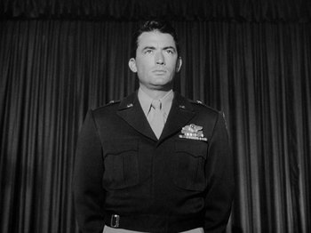 Movie still from “Twelve O'Clock High” (1949), directed by Henry King – Black and white photograph of a man in military uniform; Medium shot, Low angle