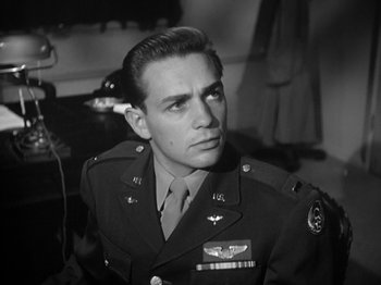 Movie still from “Twelve O'Clock High” (1949), directed by Henry King – A man in a military uniform looking to his left; Close Up shot, Low angle