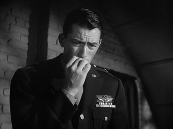 Movie still from “Twelve O'Clock High” (1949), directed by Henry King – Black and white photograph of a man in military uniform; Close Up shot, Low angle