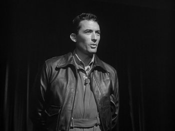 Movie still from “Twelve O'Clock High” (1949), directed by Henry King – Black and white photograph of a man wearing a leather jacket; Medium shot, Low angle