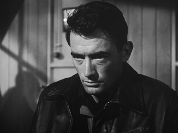 Movie still from “Twelve O'Clock High” (1949), directed by Henry King – Black and white photograph of a man wearing a leather jacket; Close Up shot, Low angle