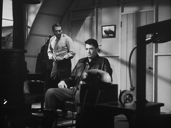 Movie still from “Twelve O'Clock High” (1949), directed by Henry King – Two men sitting in chairs in a room; Wide shot, Low angle