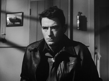 Movie still from “Twelve O'Clock High” (1949), directed by Henry King – Black and white photograph of a man wearing a leather jacket; Close Up shot, Low angle
