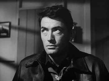 Movie still from “Twelve O'Clock High” (1949), directed by Henry King – Black and white photograph of a man wearing a leather jacket; Close Up shot, Low angle