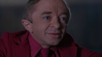 Movie still from “Twin Peaks: Fire Walk with Me” (1992), directed by David Lynch – A person wearing a suit and tie; Close Up shot, High angle