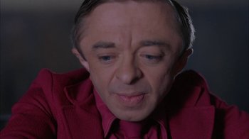 Movie still from “Twin Peaks: Fire Walk with Me” (1992), directed by David Lynch – A person wearing a shirt and tie; Close Up shot, High angle