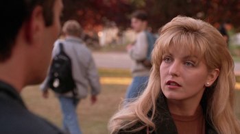 Movie still from “Twin Peaks: Fire Walk with Me” (1992), directed by David Lynch – A woman with long blonde hair is looking to her left; Close Up shot, Over the shoulder angle