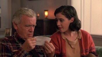 Movie still from “Twin Peaks: Fire Walk with Me” (1992), directed by David Lynch – An older man and a young woman looking at a piece of paper; Close Up shot, High angle