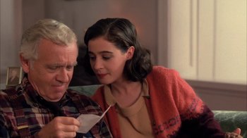 Movie still from “Twin Peaks: Fire Walk with Me” (1992), directed by David Lynch – An older man and a young woman looking at a piece of paper; Close Up shot, High angle