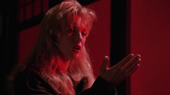 Movie still from “Twin Peaks: Fire Walk with Me” (1992), directed by David Lynch – A woman with long blonde hair is holding out her hand; Close Up shot, Low angle