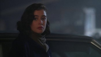 Movie still from “Twin Peaks: Fire Walk with Me” (1992), directed by David Lynch – A young woman with a scarf looking into the distance; Close Up shot, Over the shoulder angle