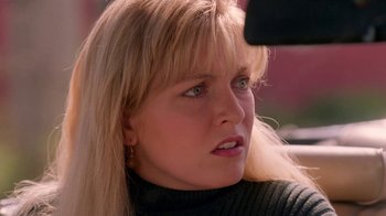 Movie still from “Twin Peaks: Fire Walk with Me” (1992), directed by David Lynch – A person with blonde hair; Close Up shot, Over the shoulder angle