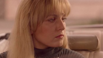 Movie still from “Twin Peaks: Fire Walk with Me” (1992), directed by David Lynch – A person with long blonde hair; Close Up shot, Low angle
