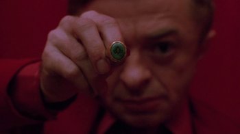 Movie still from “Twin Peaks: Fire Walk with Me” (1992), directed by David Lynch – A person wearing a ring; Extreme Close Up shot, Overhead angle