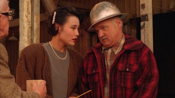 Movie still from “Twin Peaks: Fire Walk with Me” (1992), directed by David Lynch – An older man and a younger woman looking at each other; Medium shot, High angle