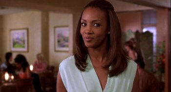 Movie still from “Two Can Play That Game” (2001), directed by Mark Brown – A woman that is looking at the camera; Close Up shot, Over the shoulder angle