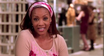 Movie still from “Two Can Play That Game” (2001), directed by Mark Brown – A person wearing a headband; Close Up shot, Over the shoulder angle