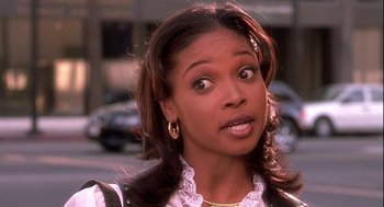 Movie still from “Two Can Play That Game” (2001), directed by Mark Brown – A person with a surprised look on their face; Close Up shot, Over the shoulder angle