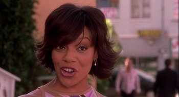 Movie still from “Two Can Play That Game” (2001), directed by Mark Brown – A person with short brown hair; Close Up shot, Low angle