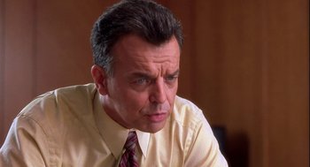 Movie still from “Two Can Play That Game” (2001), directed by Mark Brown – A person wearing a shirt and tie; Close Up shot, Low angle