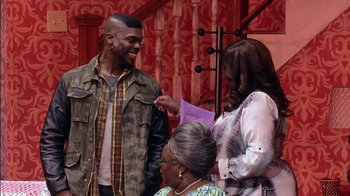 Movie still from “Madea on the Run” (2017), directed by Derrick Doose – A group of people standing next to each other on a stage; Medium shot, Over the shoulder angle