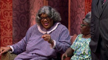 Movie still from “Madea on the Run” (2017), directed by Derrick Doose – Two women sitting on a couch talking to each other; Medium shot, Over the shoulder angle