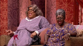 Movie still from “Madea on the Run” (2017), directed by Derrick Doose – A couple of women sitting on top of a couch; Medium shot, High angle