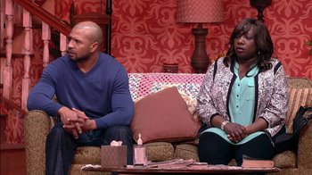 Movie still from “Madea on the Run” (2017), directed by Derrick Doose – A man and a woman sitting next to each other on a couch; Medium shot, Over the shoulder angle