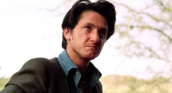 Movie still from “U Turn” (1997), directed by Oliver Stone – A person with long hair; Close Up shot, Low angle