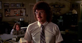 Movie still from “UHF” (1989), directed by Jay Levey – A man in a white shirt and a tie; Close Up shot, Low angle