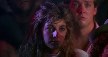 Movie still from “UHF” (1989), directed by Jay Levey – A person wearing a wig; Close Up shot, Low angle