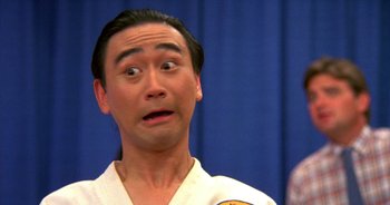 Movie still from “UHF” (1989), directed by Jay Levey – A man with a surprised look on his face; Close Up shot, Low angle