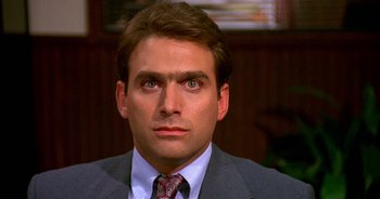 A person wearing a suit and tie
