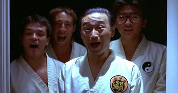 Movie still from “UHF” (1989), directed by Jay Levey – A group of young men standing next to each other; Close Up shot, Low angle