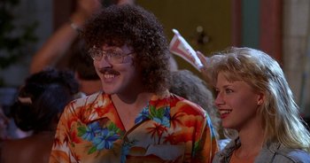 Movie still from “UHF” (1989), directed by Jay Levey – A man and a woman wearing hawaiian shirts; Close Up shot, Over the shoulder angle