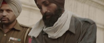 Movie still from “Udta Punjab” (2016), directed by Abhishek Chaubey – A man with a beard wearing a turban; Extreme Close Up shot, High angle
