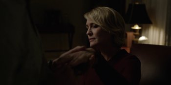 Movie still from “House of Cards” (2013), created by Beau Willimon – A woman sitting in front of a computer monitor; Close Up shot, Over the shoulder angle