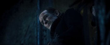 Movie still from “Underworld: Rise of the Lycans” (2009), directed by Patrick Tatopoulos – A person wearing a black jacket; Close Up shot, Low angle
