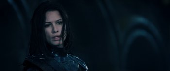 Movie still from “Underworld: Rise of the Lycans” (2009), directed by Patrick Tatopoulos – A person with long black hair; Close Up shot, Over the shoulder angle
